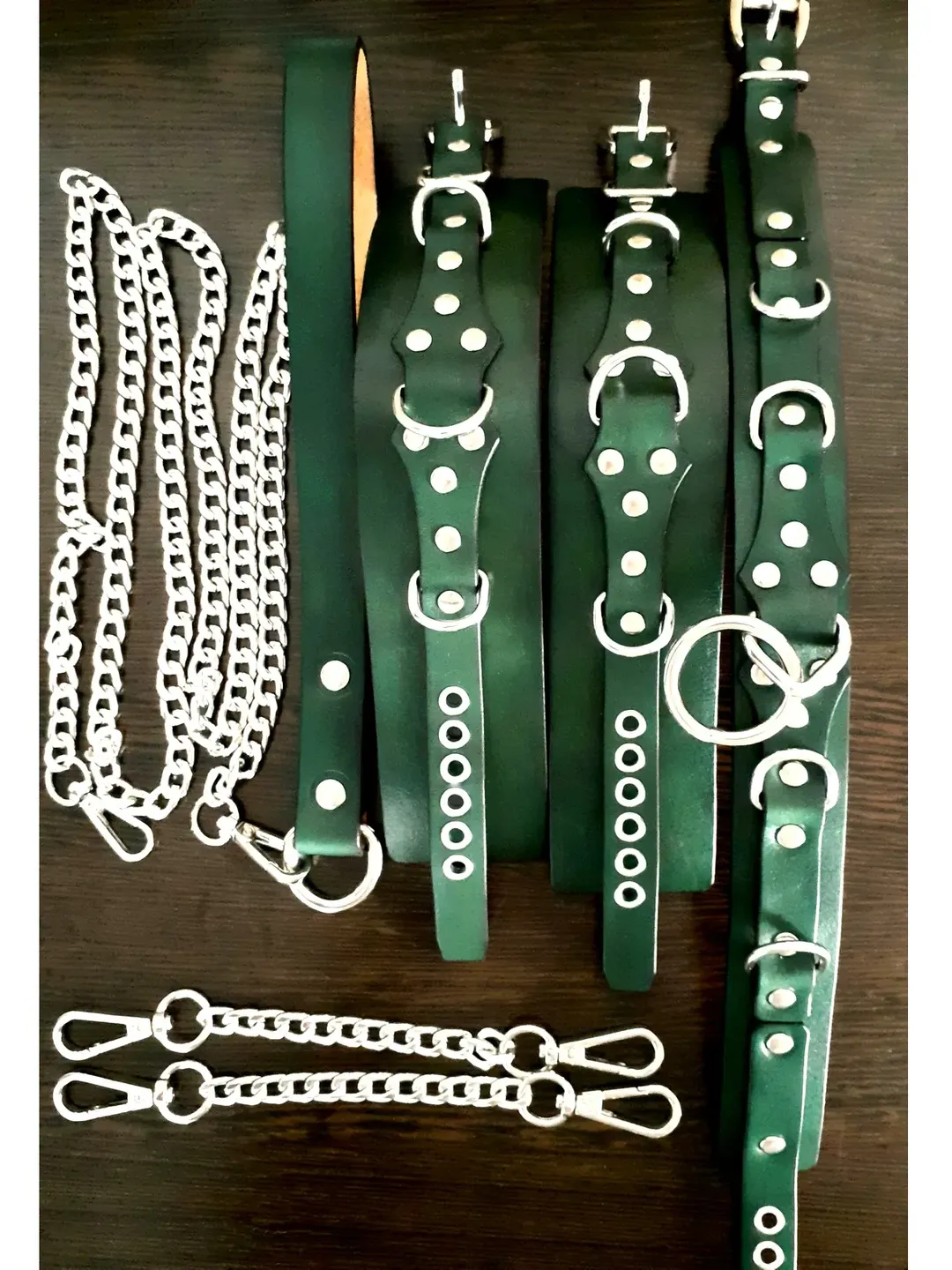 Handcrafted green leather bondage restraint kit for submissive