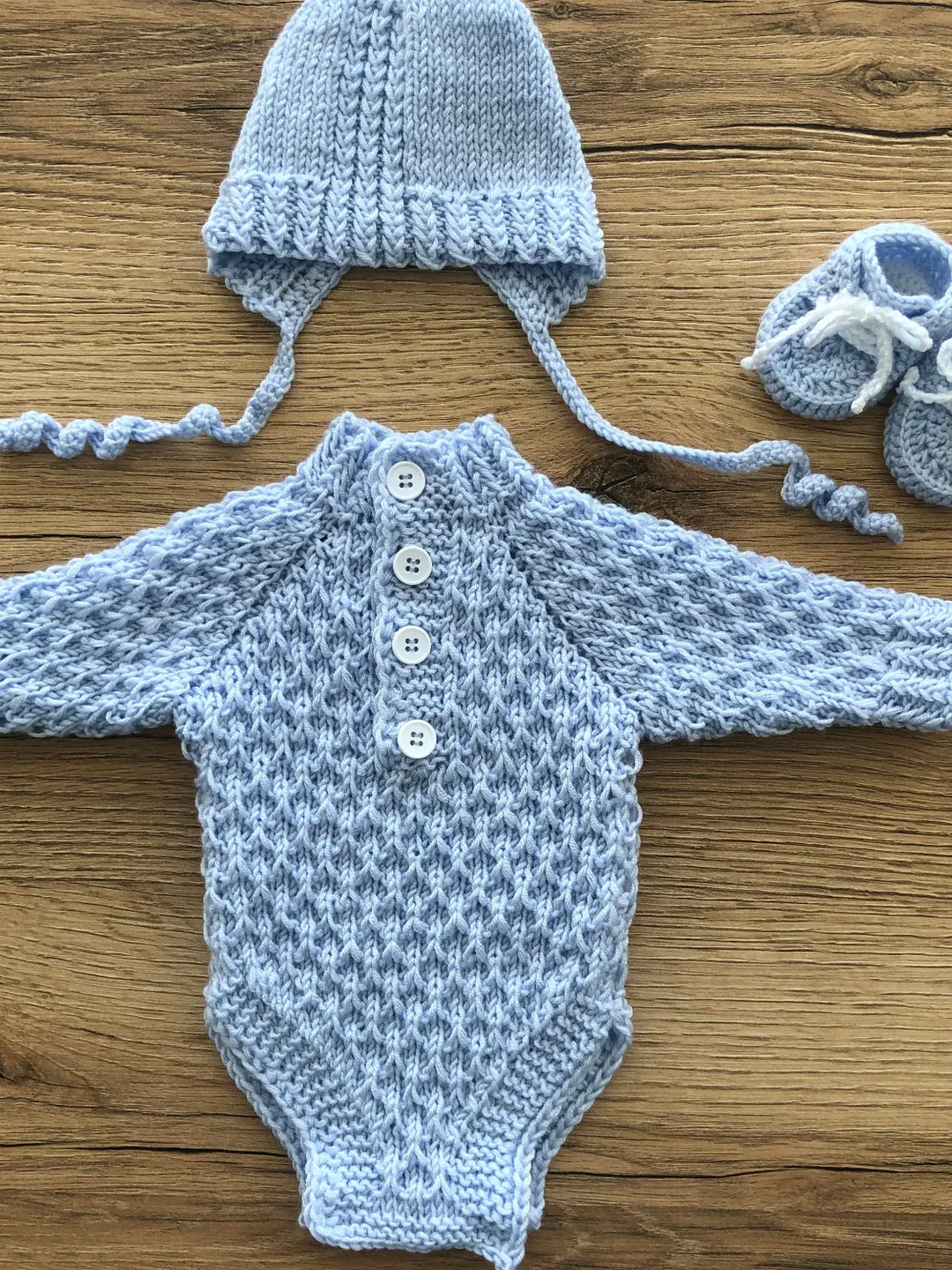 Blue knit romper, hat and booties for baby boy. Photo props for baby boy. Take home outfit for boy.