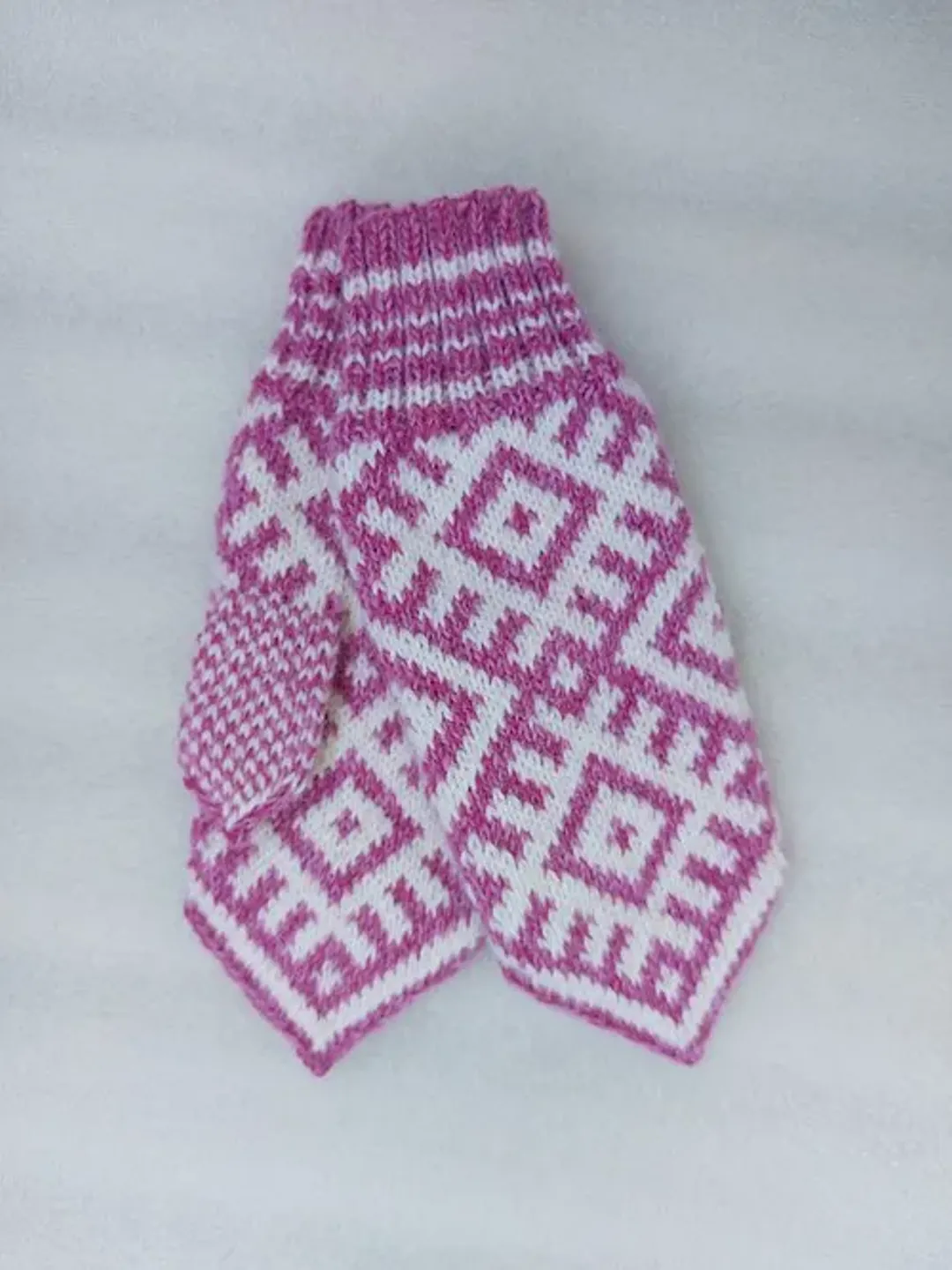 Women's hand-knitted wool mittens are very warm with a pattern