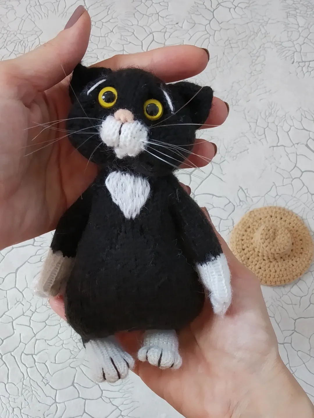 Cat themed gifts Black and white stuffed cat in a hat, beige knitted cat, orange stuffed kitten, white knitted cat