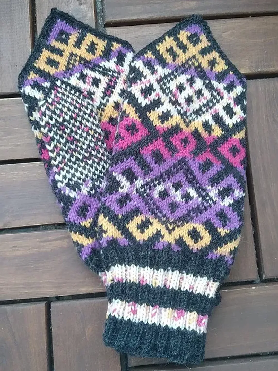 Women's hand-knitted wool mittens are very warm with a pattern