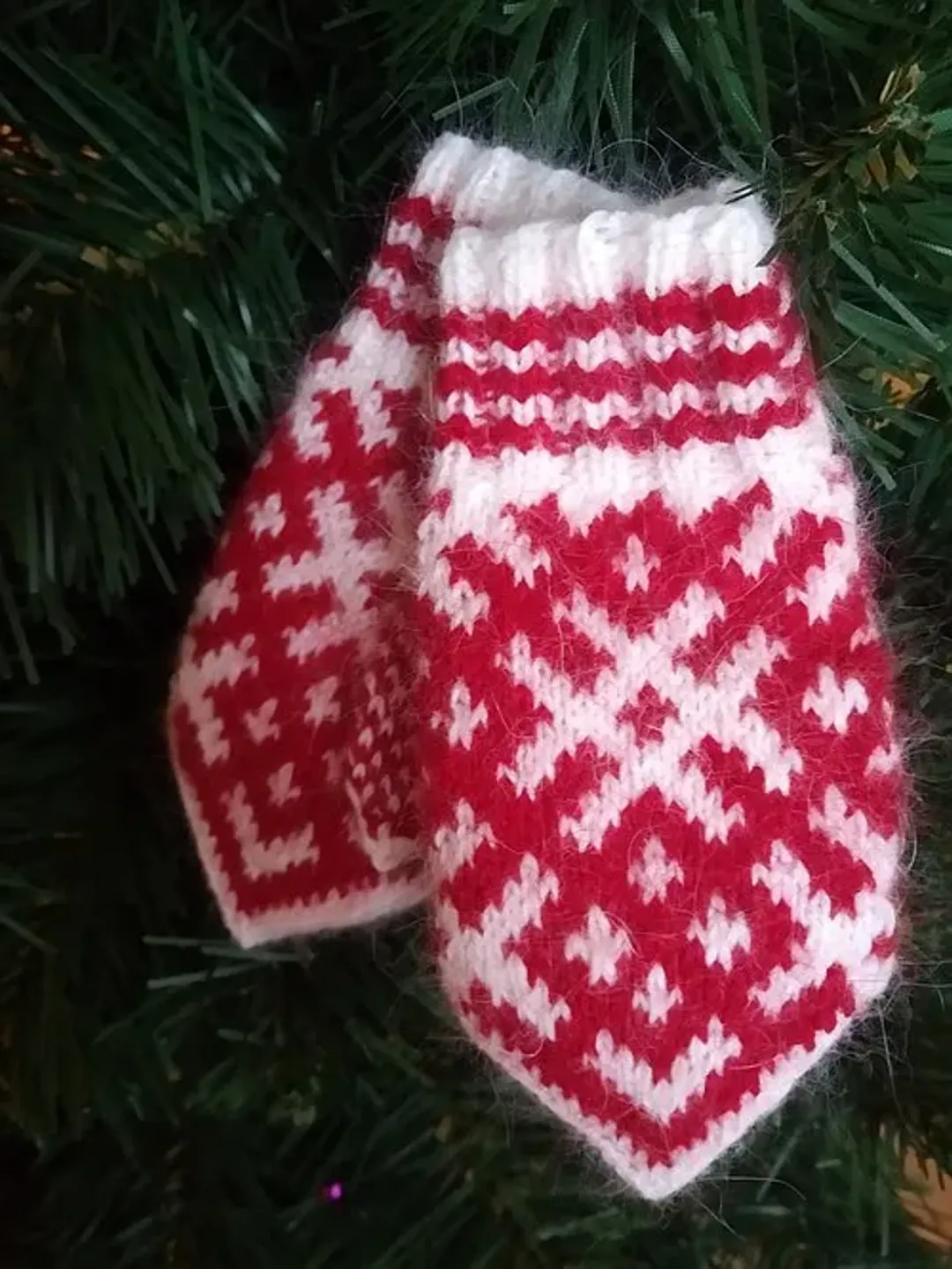 Children's hand-knitted wool mittens are very warm with a pattern
