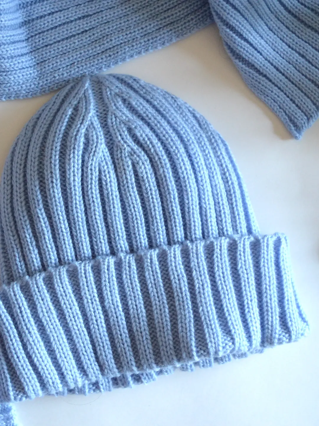 Blue knitted hat with lapel