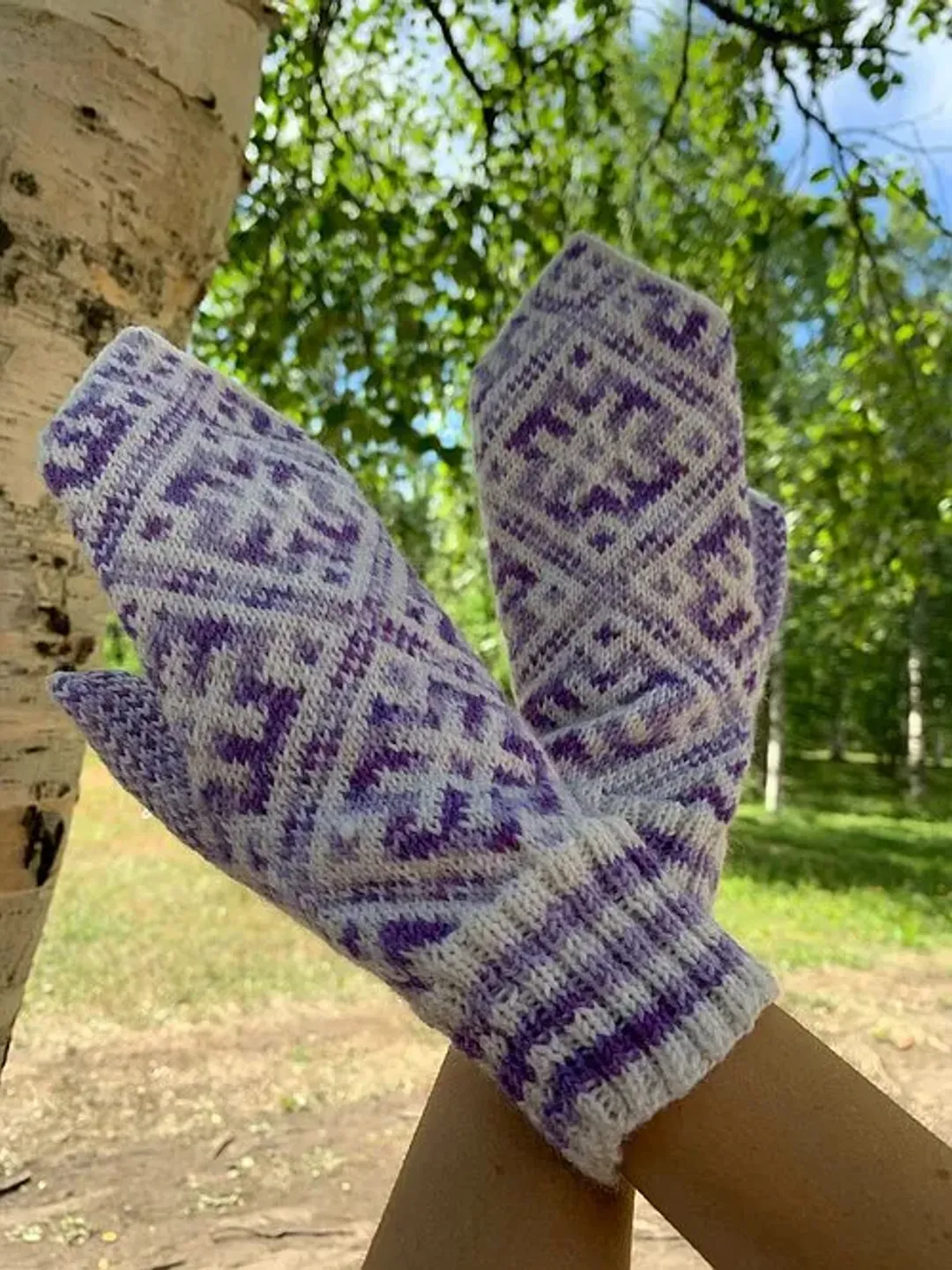Women's hand-knitted wool mittens are very warm with a pattern