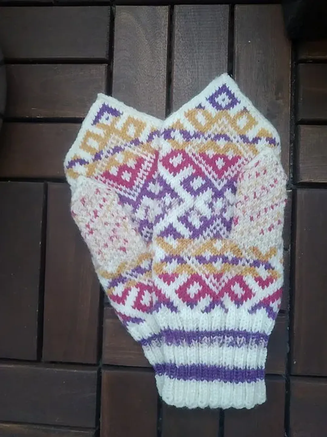 Women's hand-knitted wool mittens are very warm with a pattern