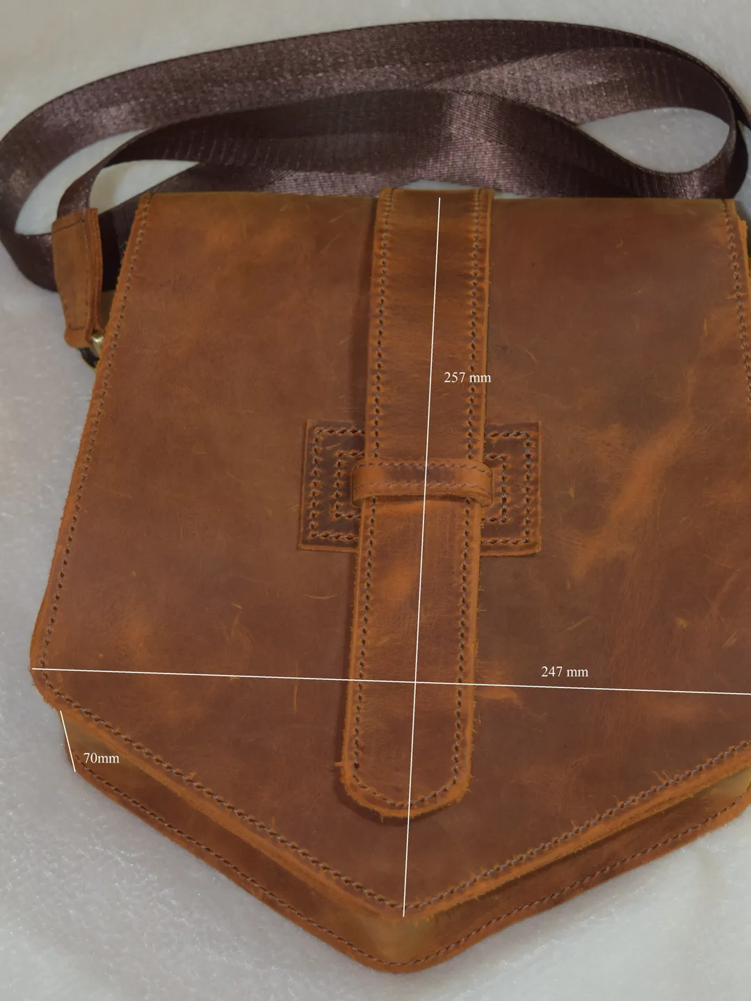 Leather messenger bag on the shoulder