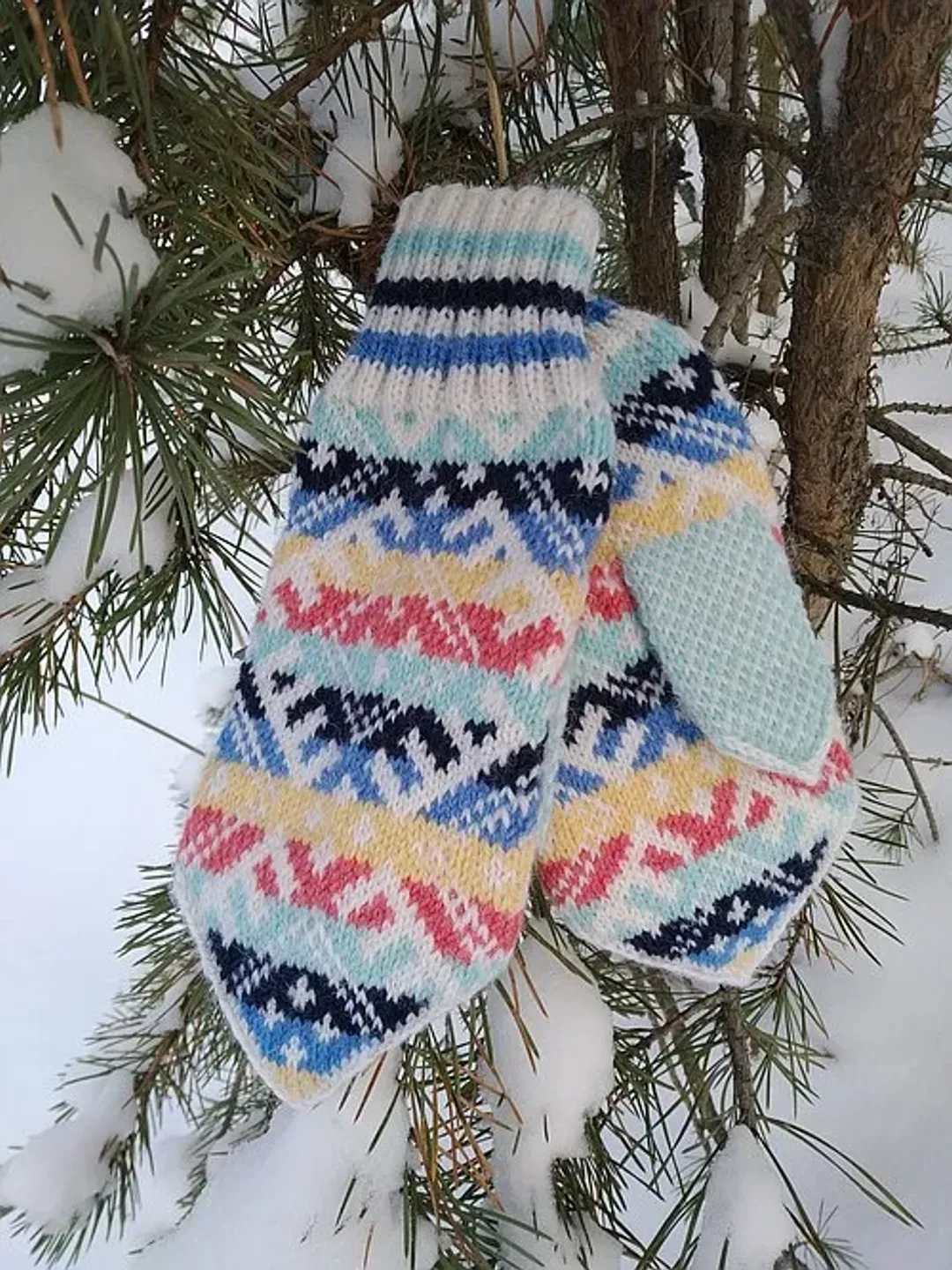 Women's hand-knitted wool mittens are very warm with a pattern