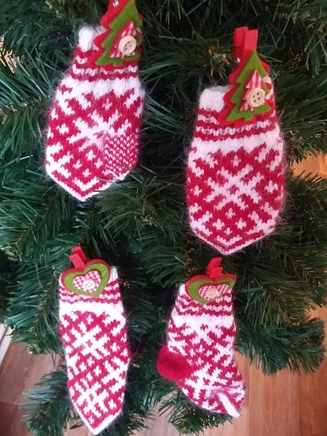 Children's knitted set woolen socks and handmade mittens with a pattern