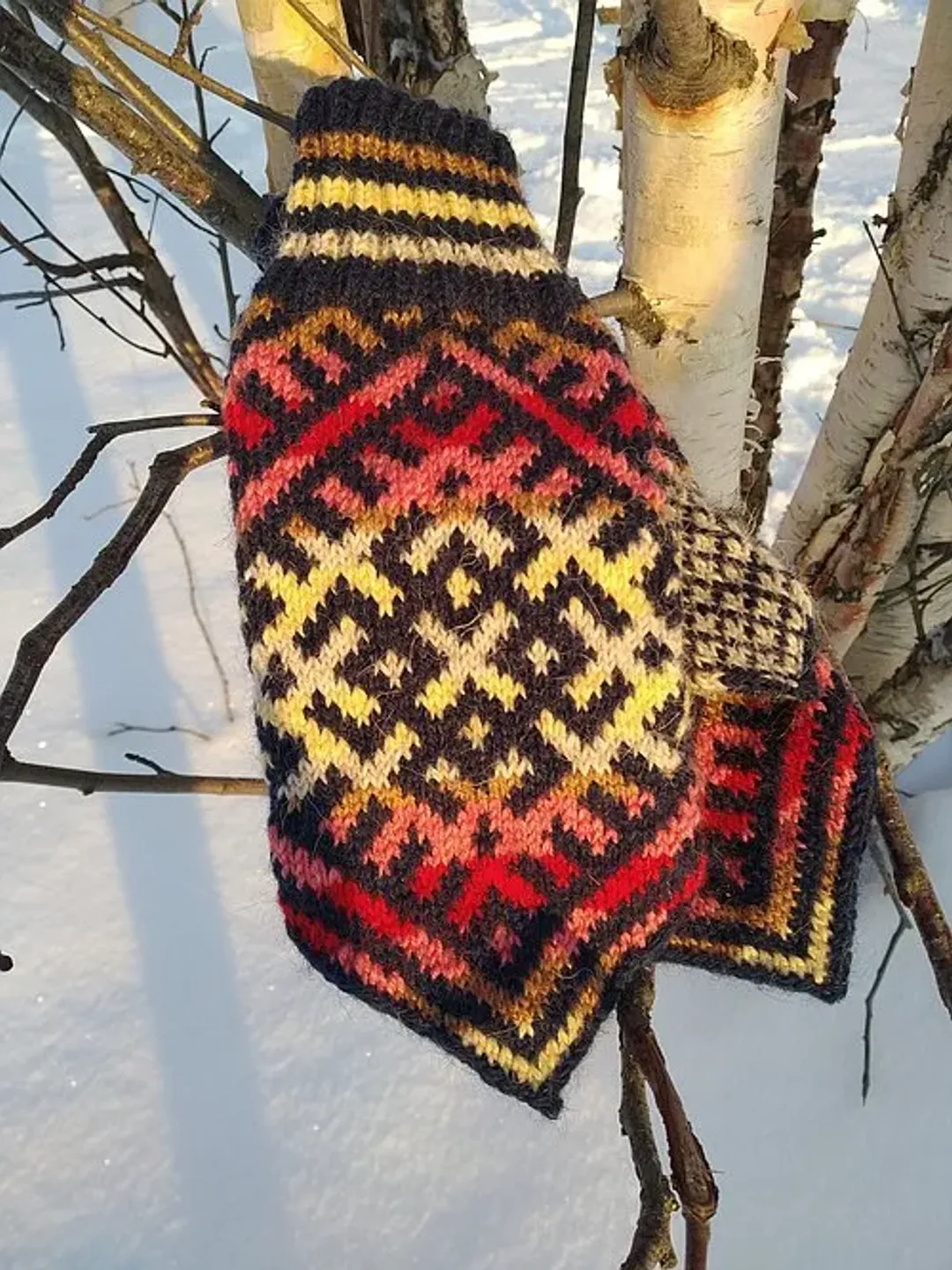 Women's hand-knitted wool mittens are very warm with a pattern