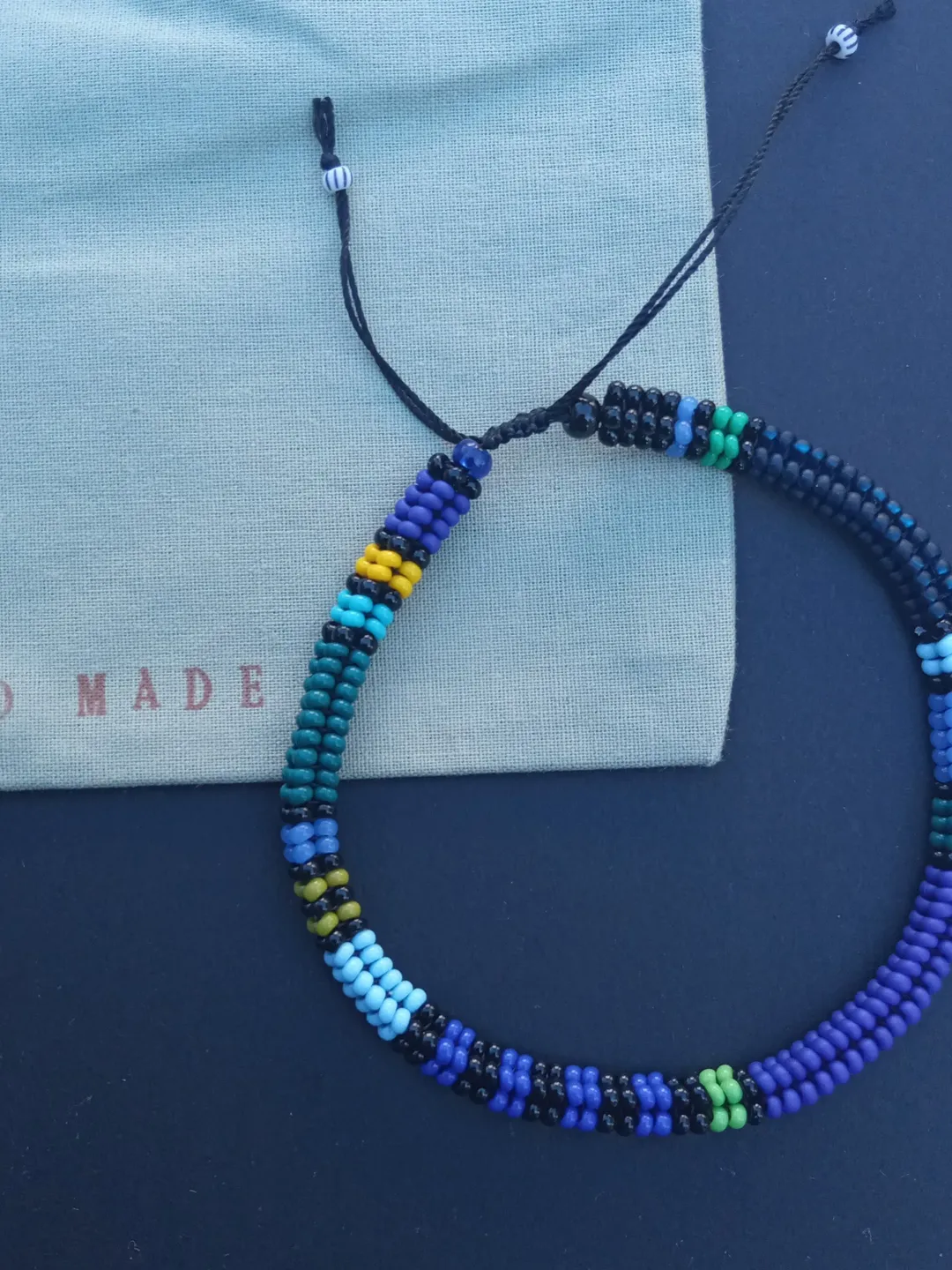 Beaded men's bracelet in dark blue color