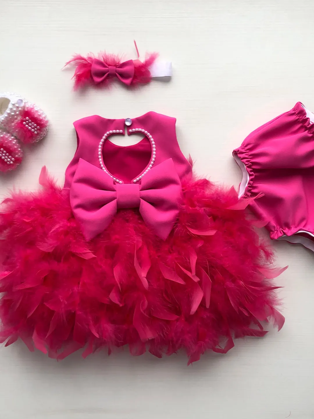 Fuchsia dress with feathers and pearls, booties, panties and headband. First birthday dress. Flower girl dress. Take home outfit for girl.