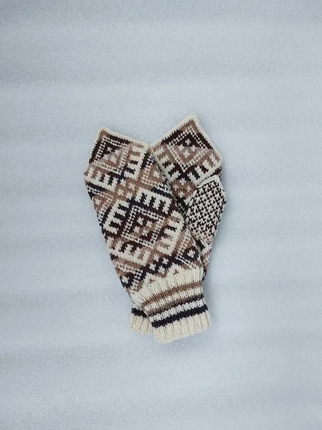 Women's hand-knitted wool mittens are very warm with a pattern