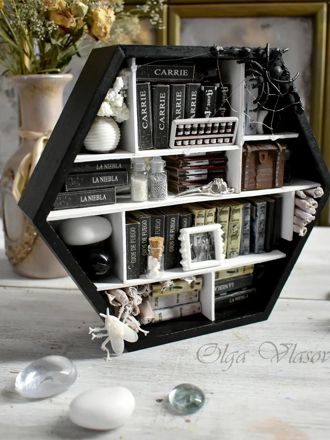 Wooden black-white mini library with minibooks