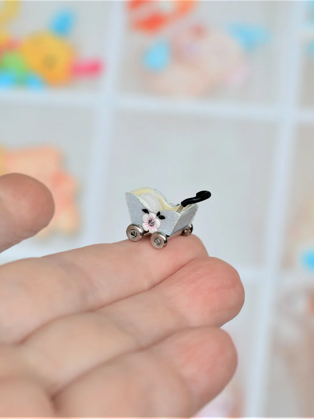 Miniature doll stroller. 1:48 scale. Dollhouse toy. Baby stroller.