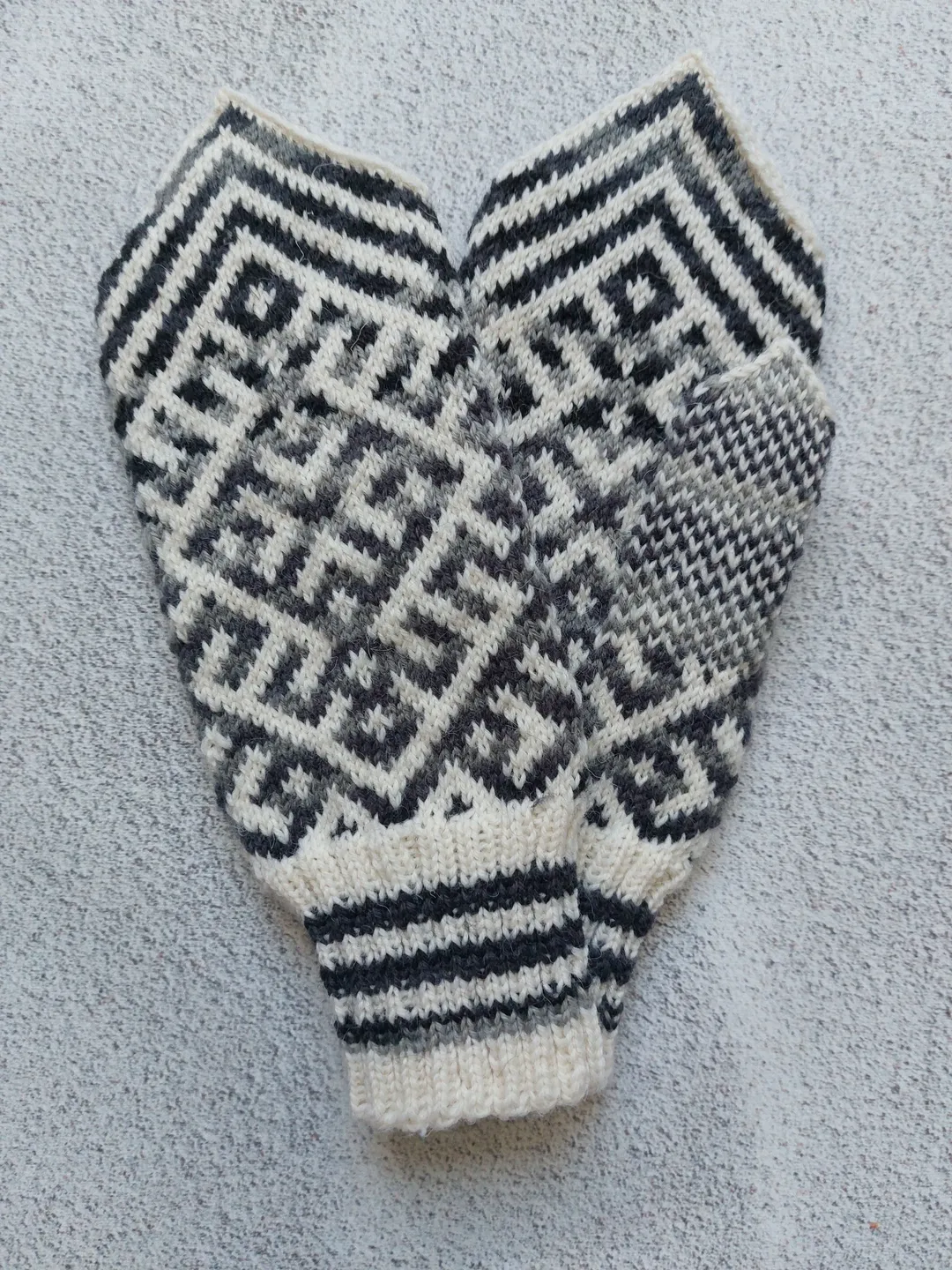 Women's hand-knitted wool mittens are very warm with a pattern