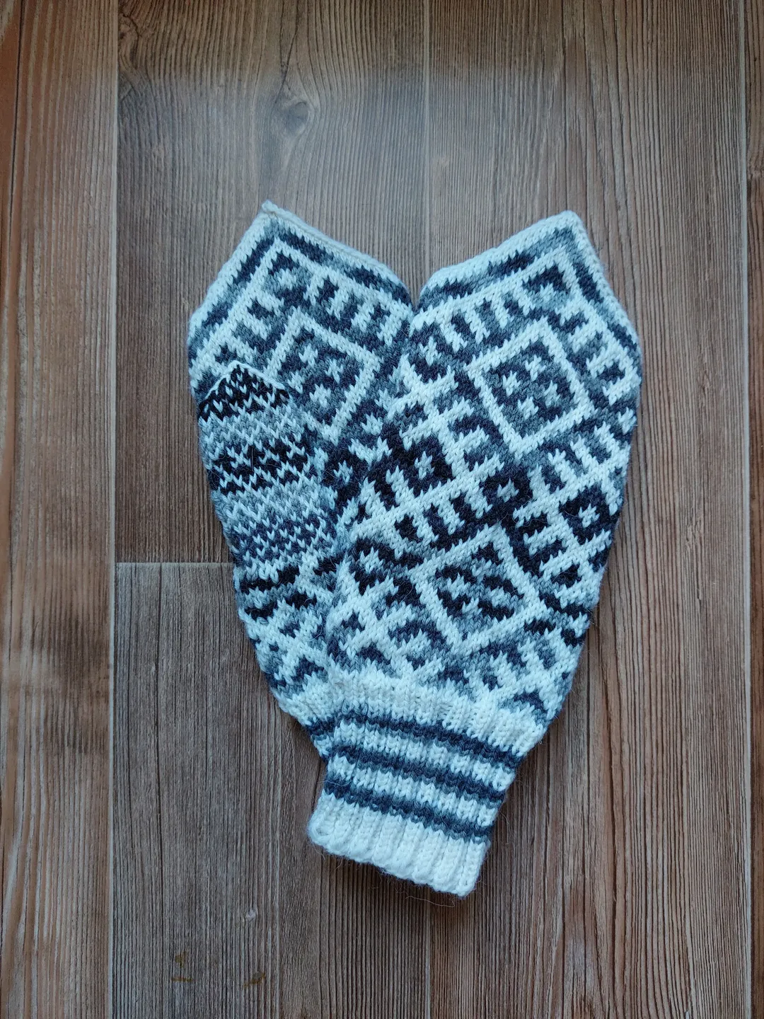 Women's hand-knitted wool mittens are very warm with a pattern