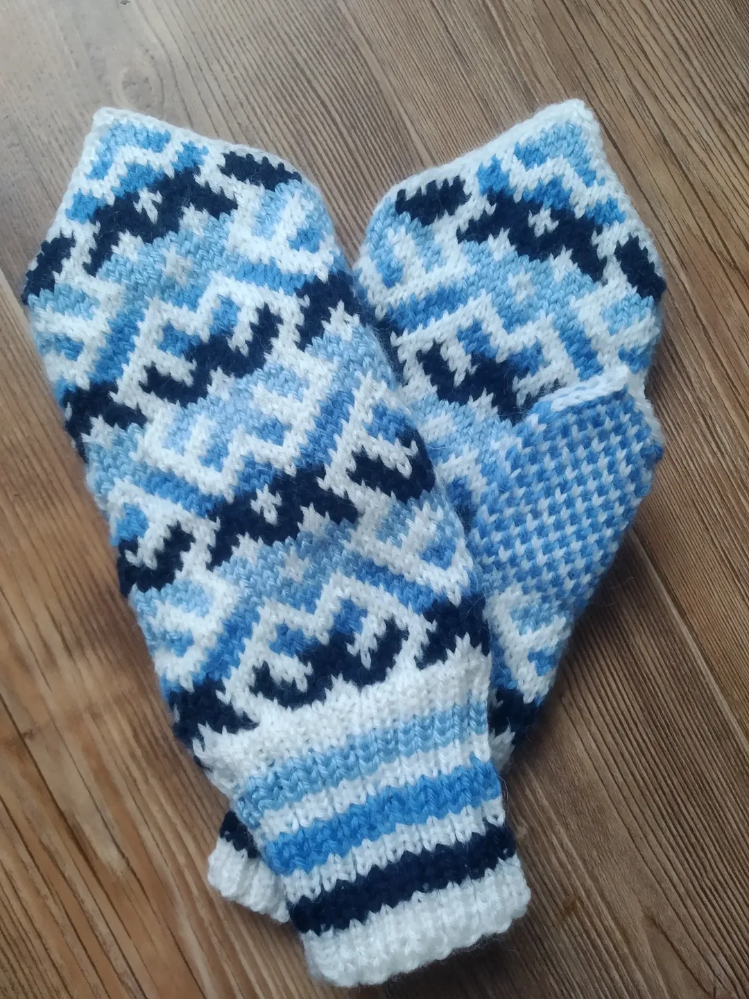 Women's hand-knitted wool mittens are very warm with a pattern