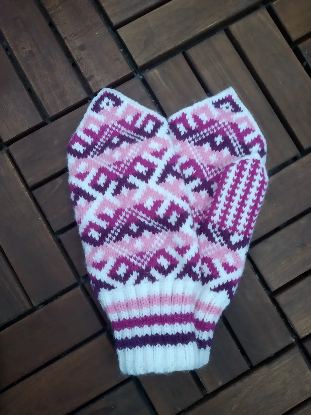 Women's hand-knitted wool mittens are very warm with a pattern