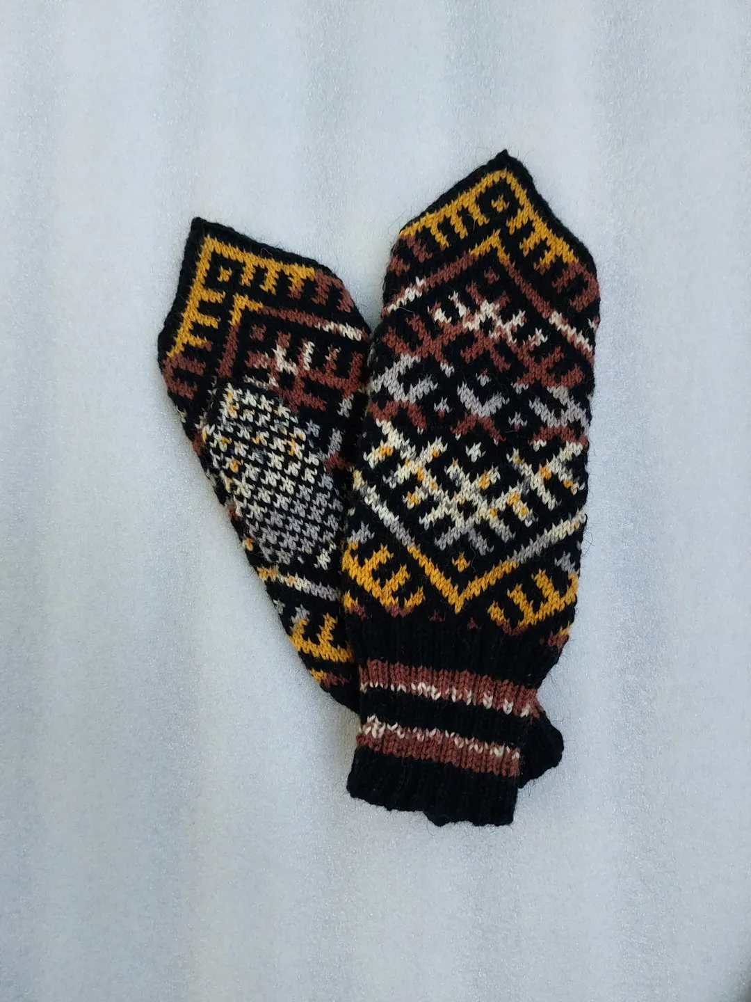 Women's hand-knitted wool mittens are very warm with a pattern