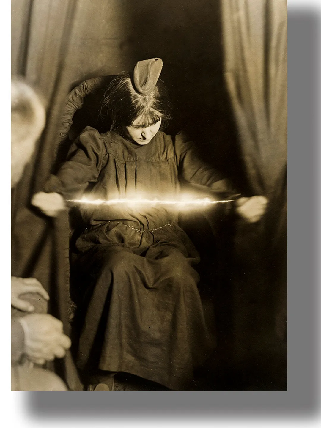 Psychic Eva Carriere at a session of materialization of ectoplasm.