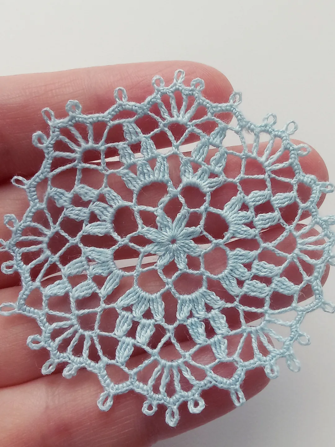 Miniature blue doily
