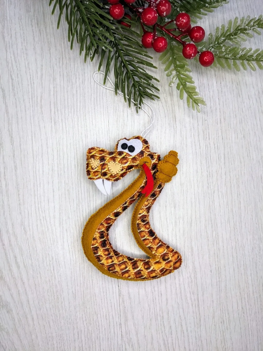 Felt snake. Brown snake - symbol of Christmas gift 2025. Felt rattlesnake