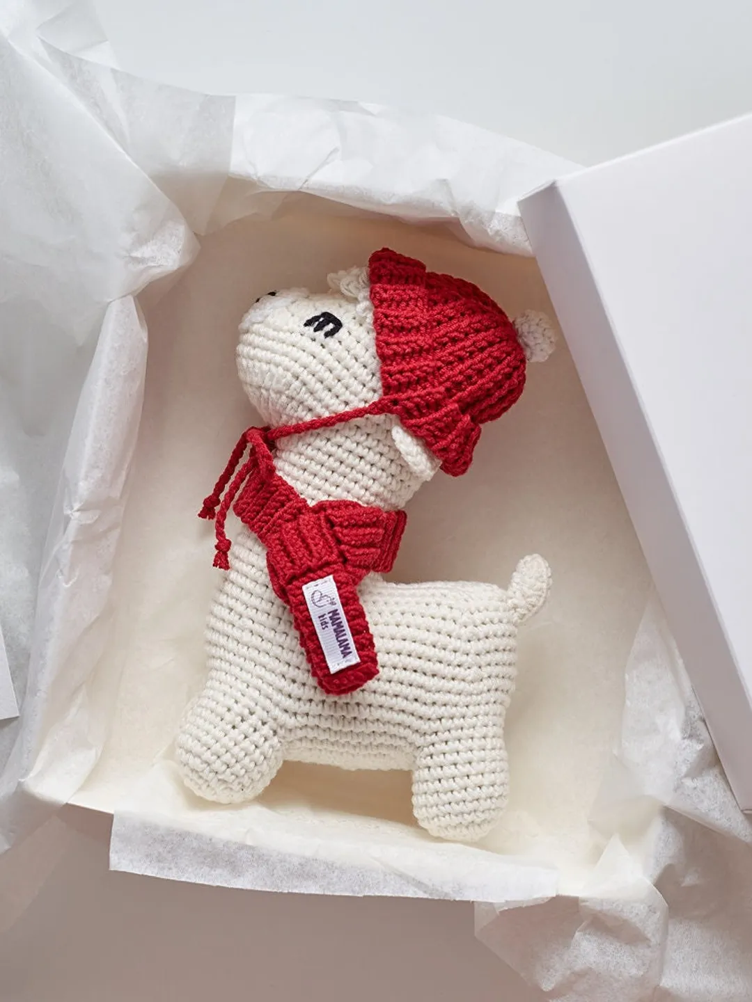 Christmas baby gift idea with llama crochet hat scarf amigurumi alpaca toy box. Cute cream and red newborn present for merry holidays basket