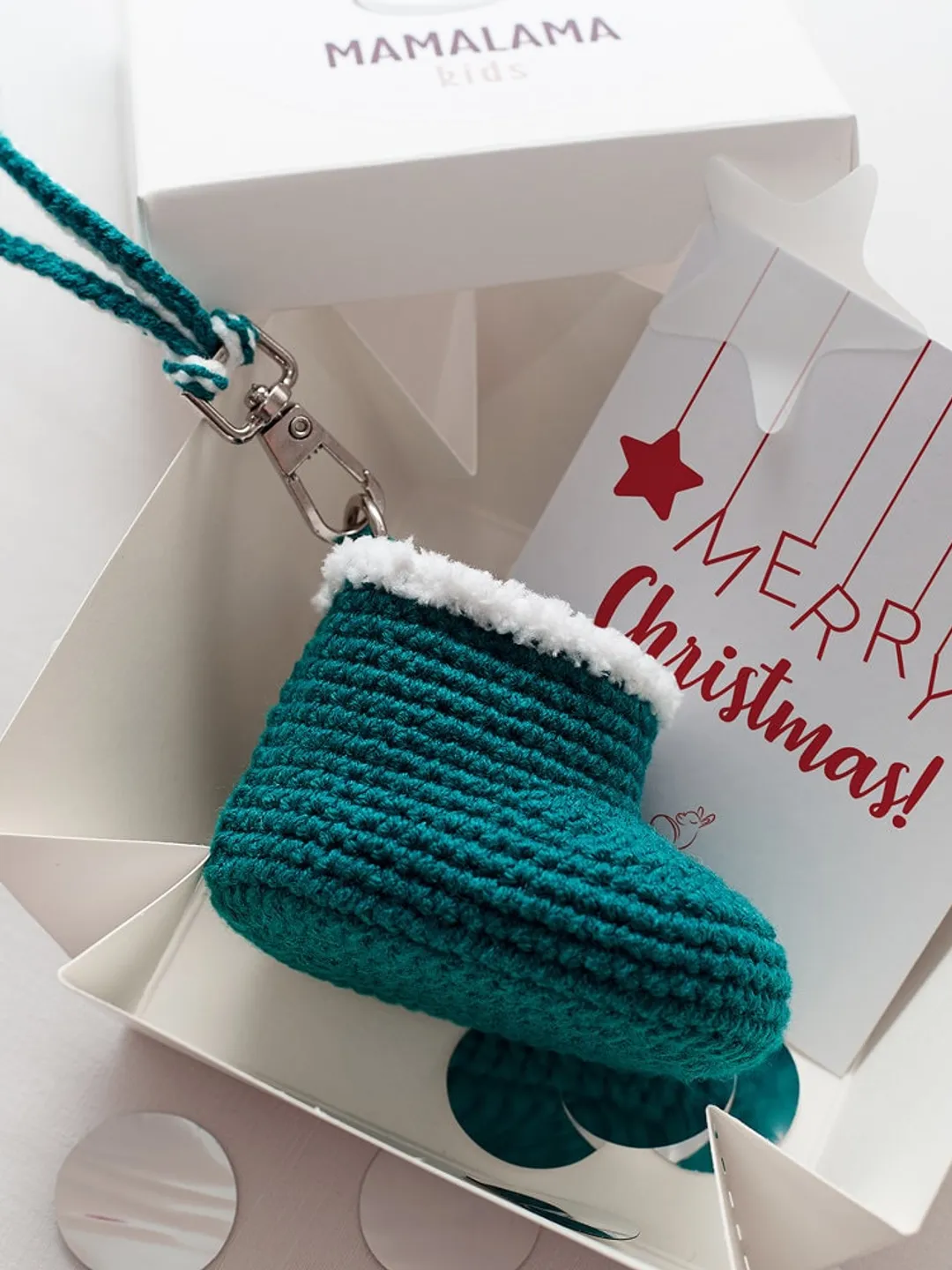Green favor keychain idea with crochet santa baby bootie trinket. Baby shower reveal pregnancy congrats party present box for guests
