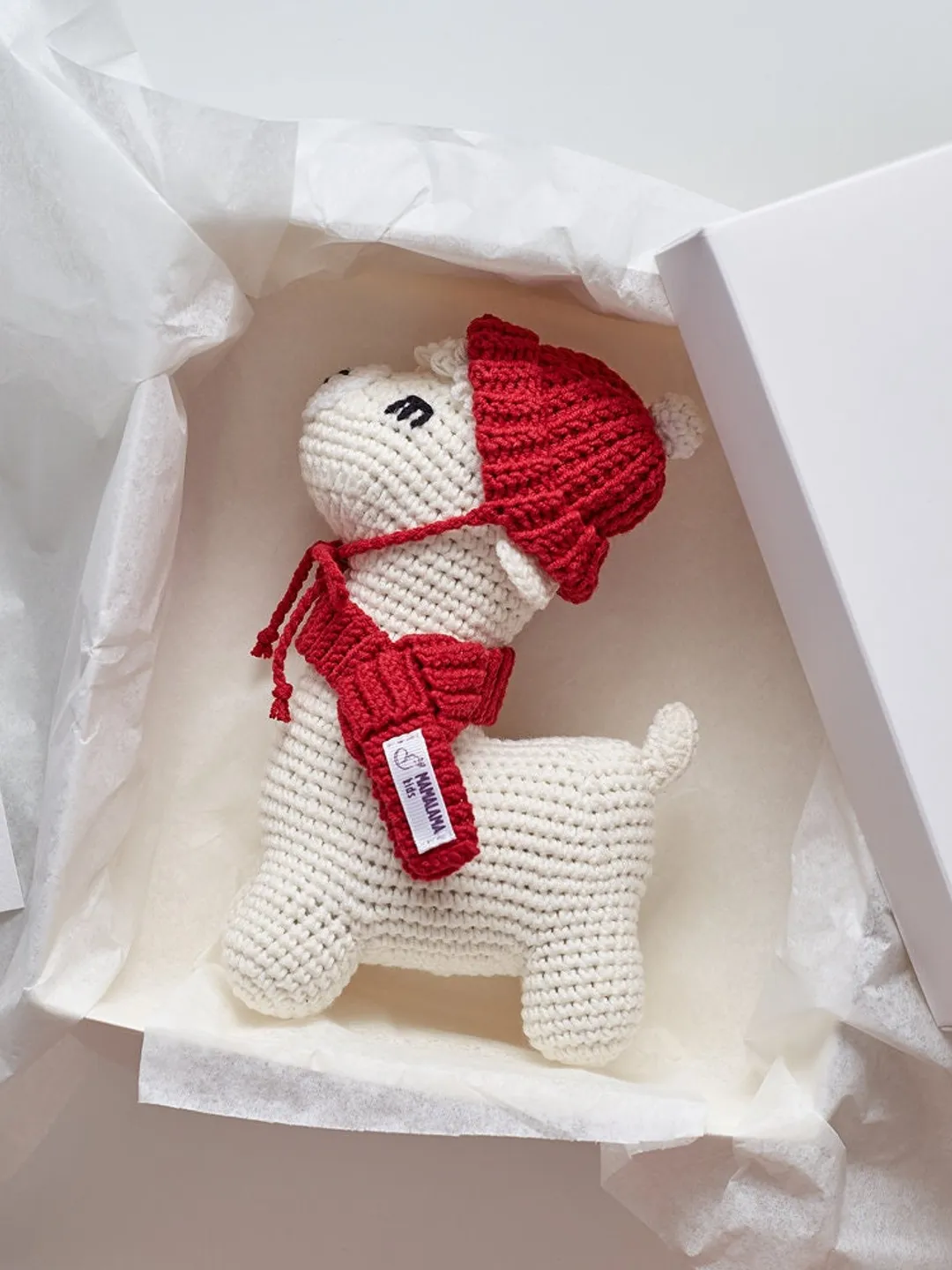Christmas baby gift idea with llama crochet hat scarf amigurumi alpaca toy box. Cute cream and red newborn present for merry holidays basket