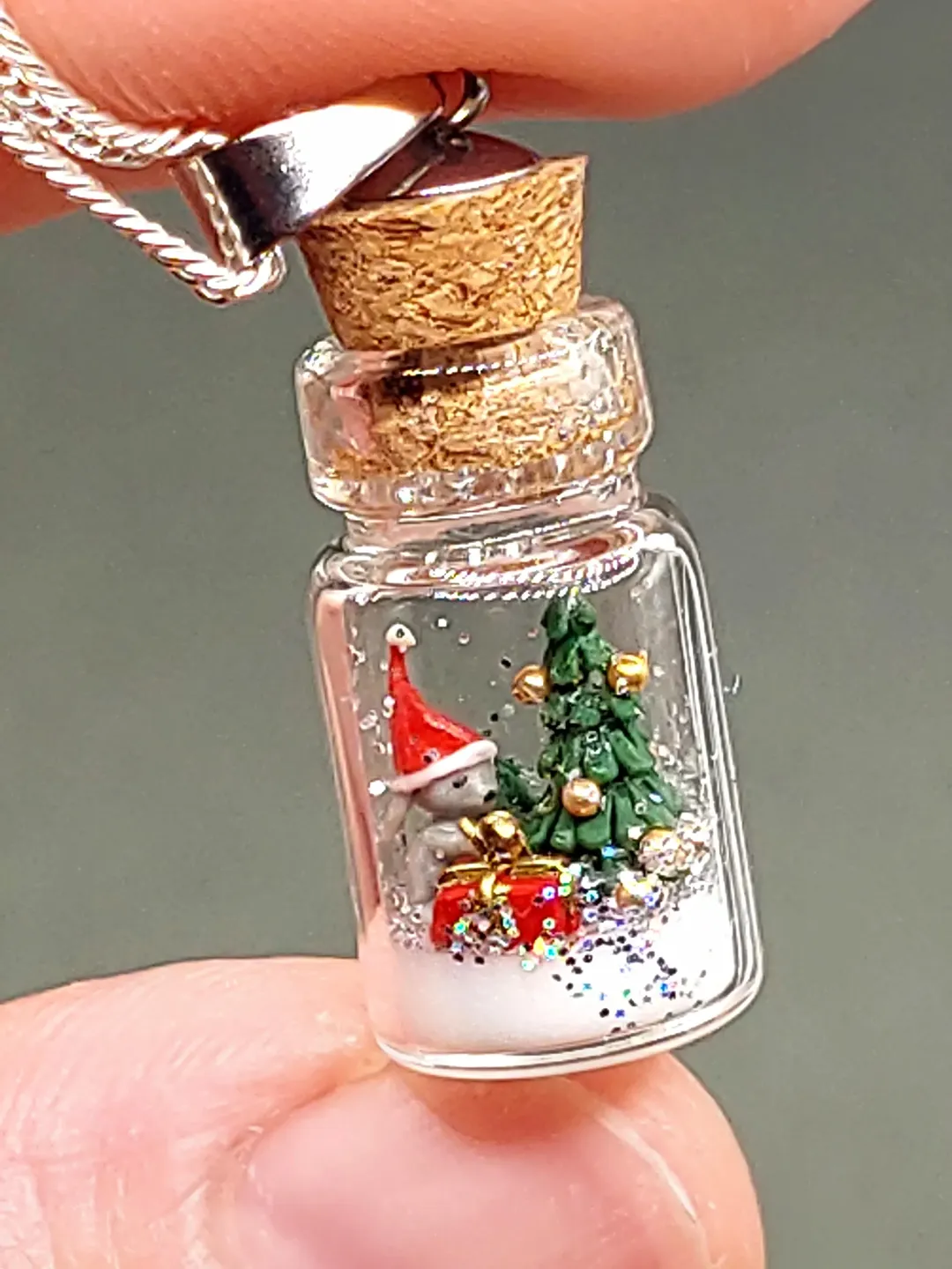 Pendant jewelry Christmas composition in a jar on a silver chain