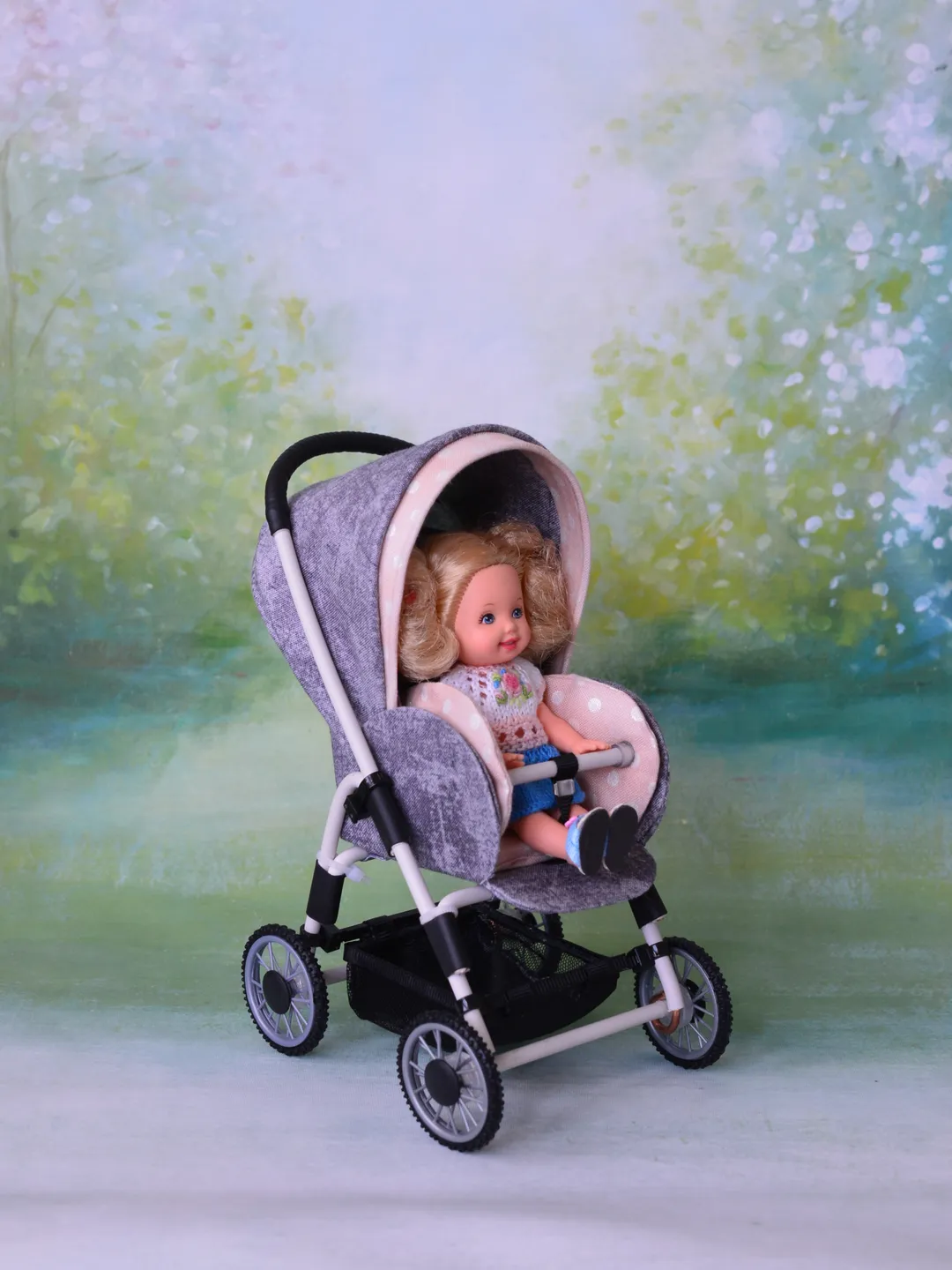Miniature toy stroller for dolls in 1/6 scale. Accessories for small dolls and poupins. Pram for Barbie doll.
