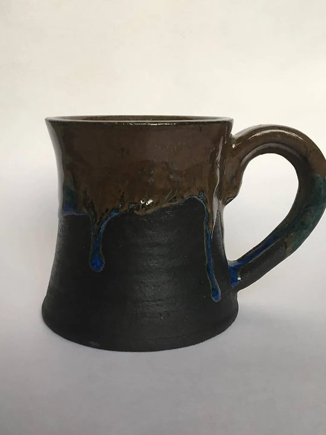 Brown, blue and black glazed stoneware mug