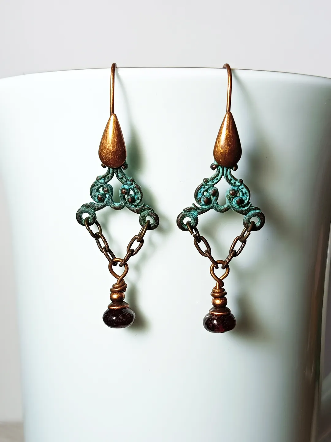 Boho Shabby chic Vintage style solid and natural copper earrings Textured patinated with a garnet bead and chain