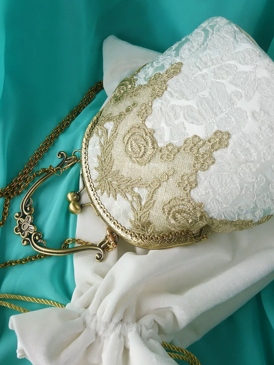 Handbag White handbag with gold lace with a handle