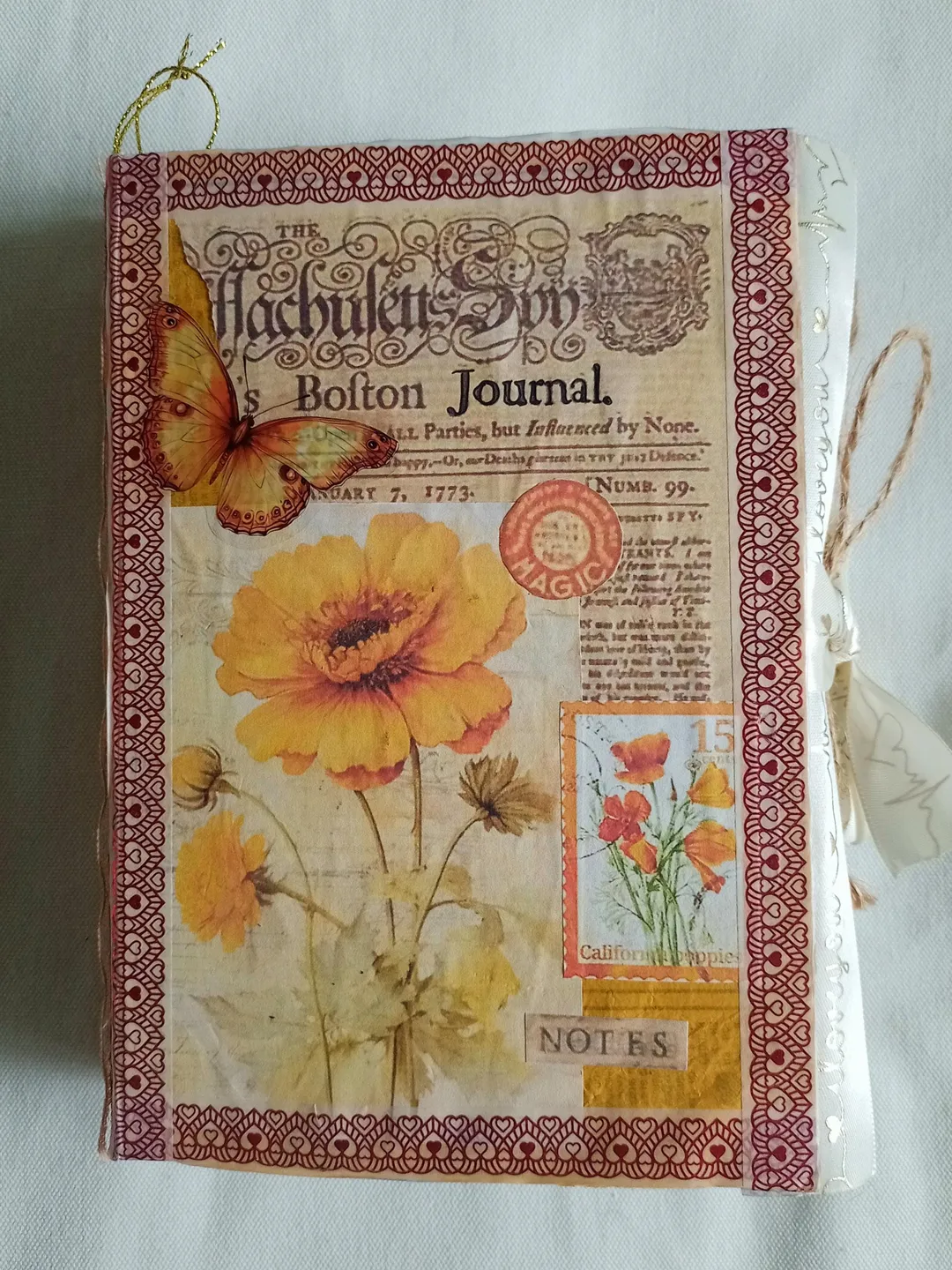 A unique handmade junkbook notebook: a bright orange journal in a
