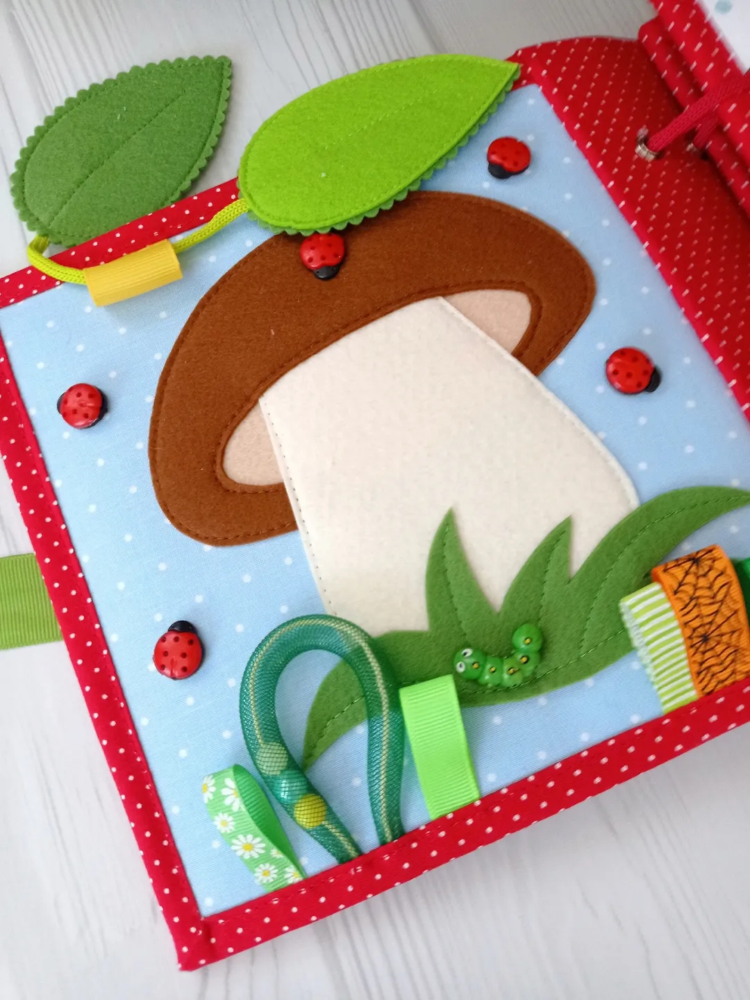 Educational book made of felt and fabric for babies.