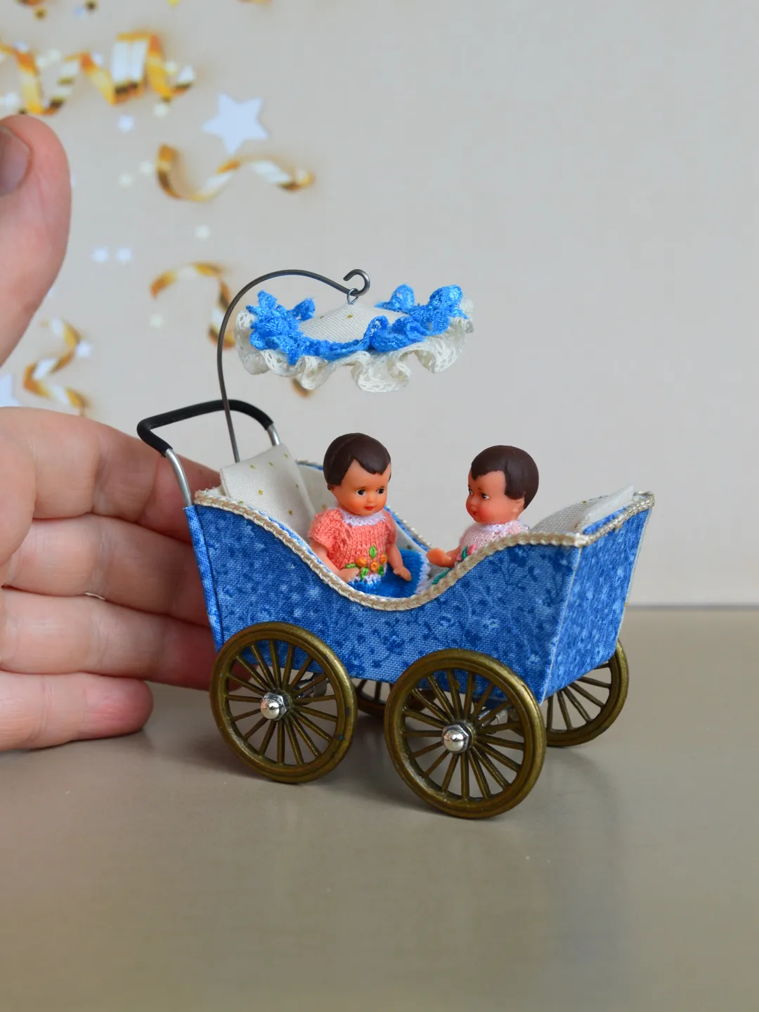 Miniature toy stroller for two small dolls. Handmade miniature stroller for small dolls.