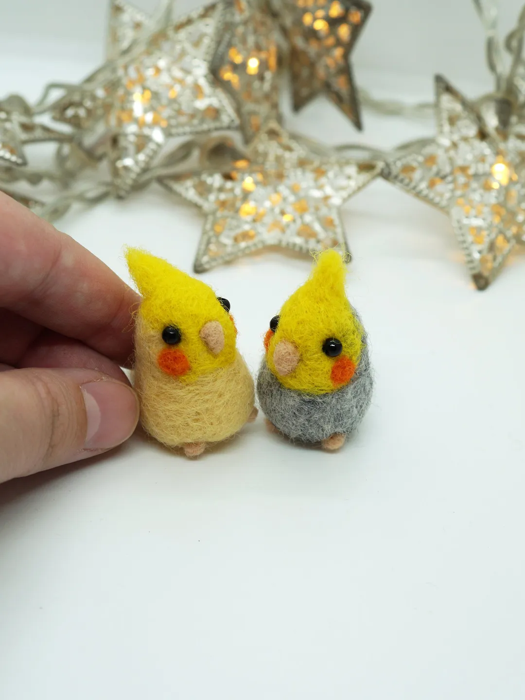 A pair of needle felted miniature cockatiels, made to order.