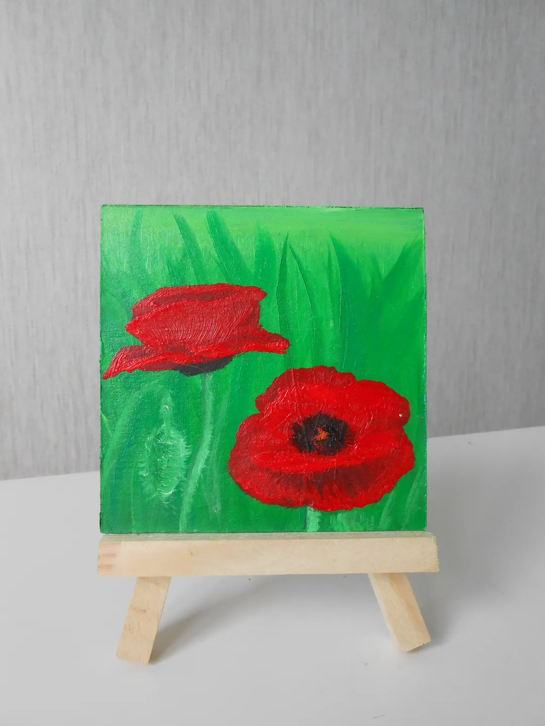 Poppies.Red flowers.A bright miniature of a poppy with oil paints.