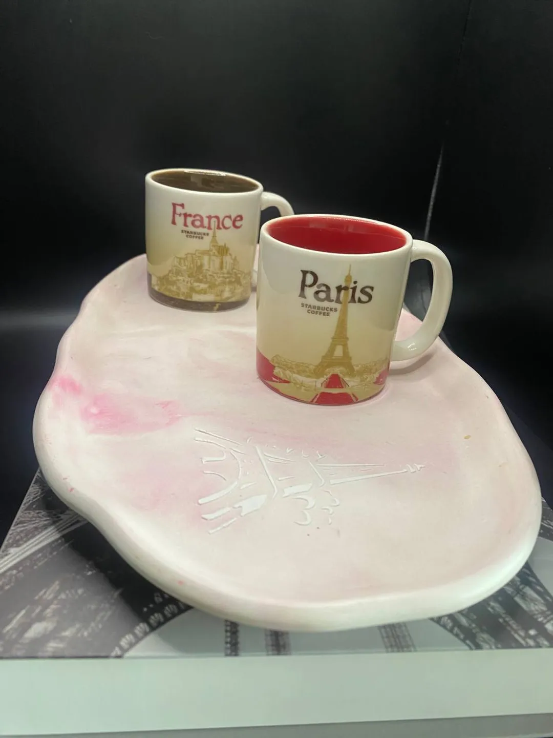 Handmade oval decorative tray made of plaster using marble pouring technique