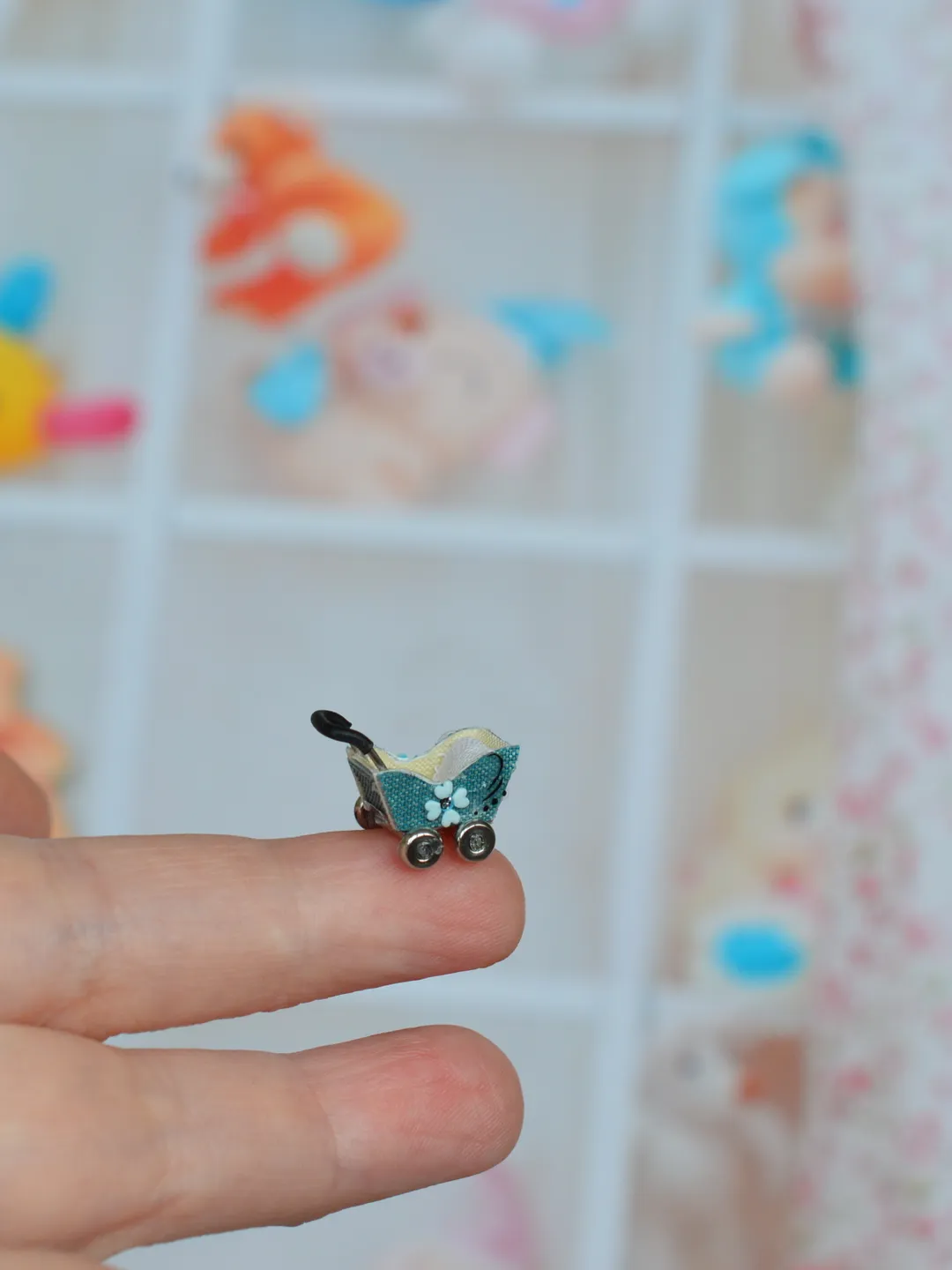 Miniature doll stroller. 1:48 scale. Dollhouse toy. Baby stroller.