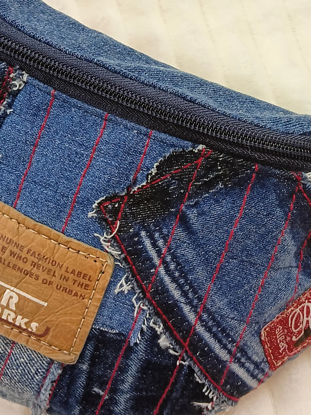 Small comfortable sling bag, handmade fanny pack, denim quilted belt bag of unusual design.