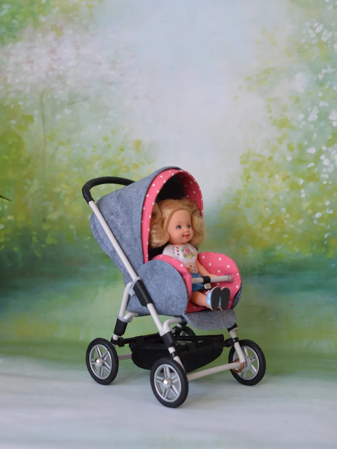 Miniature toy stroller for dolls in 1/6 scale. Accessories for small dolls and poupins. Pram for Barbie doll.