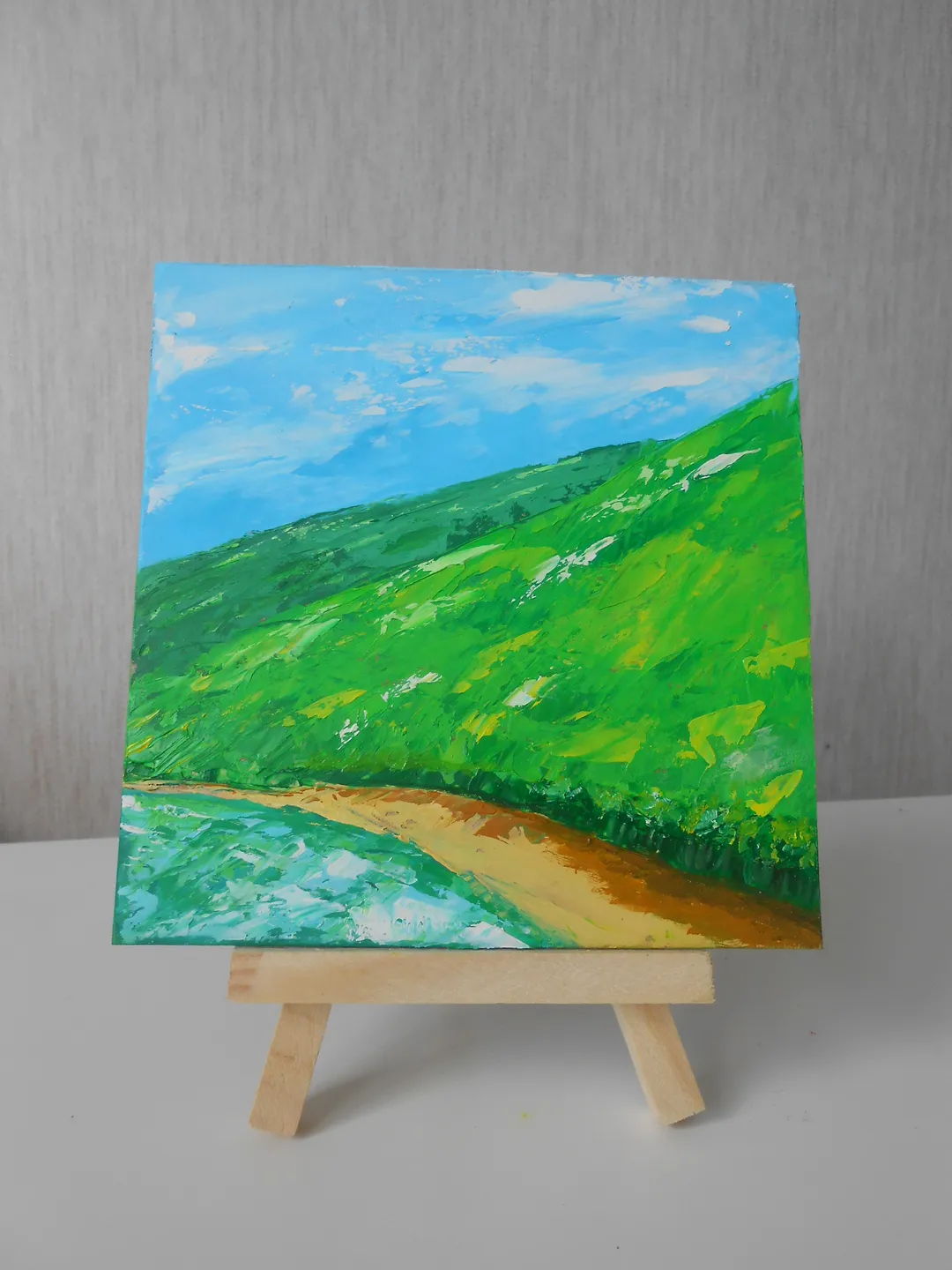 Mountains by the lake. Bright landscape with oil paints.