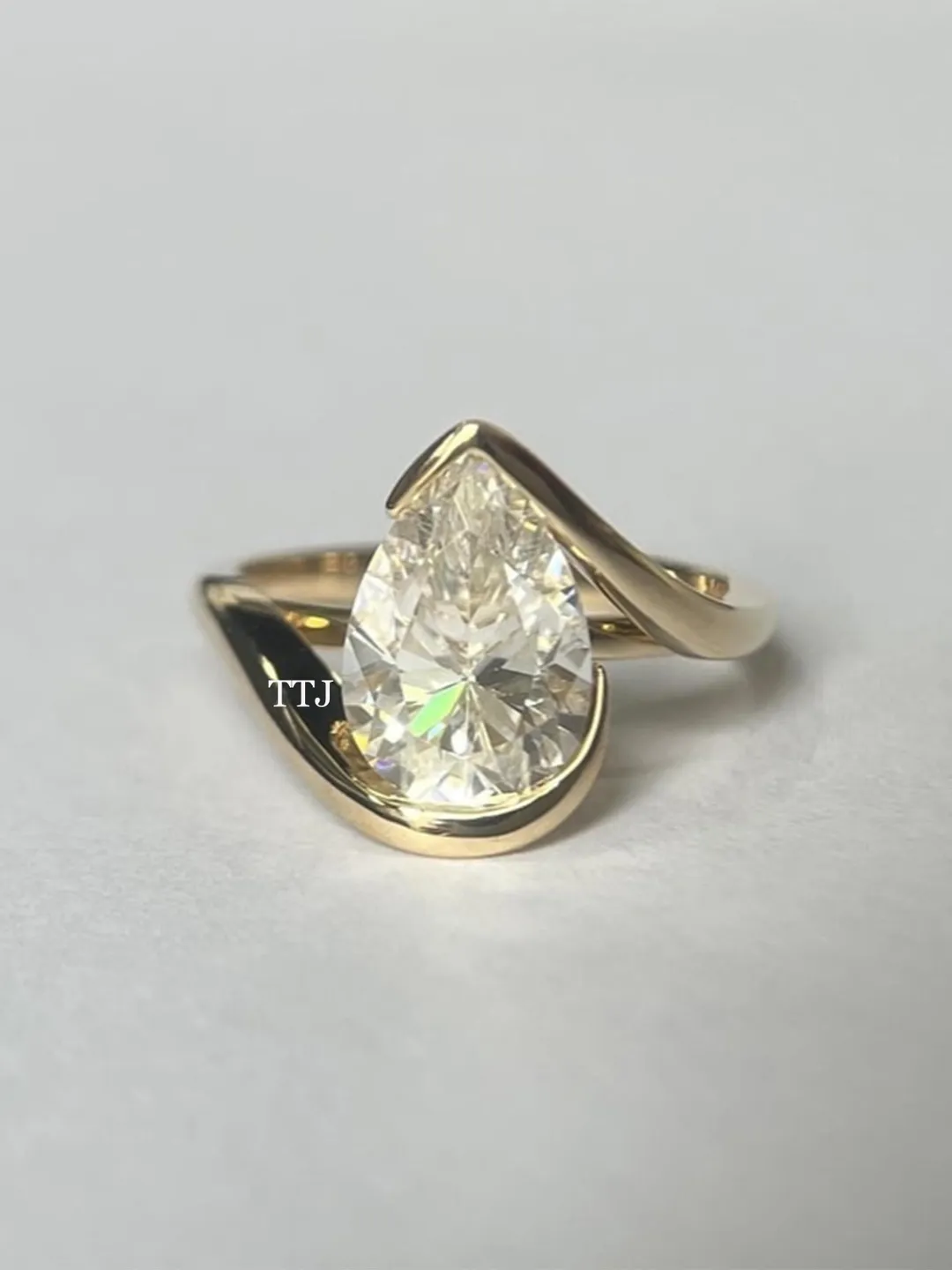 DesignerSolitaire Wedding Ring Pear Cut Moissanite Diamond Engagement Ring 14K Yellow Gold Tear Drop Bypass Ring Half Bezel Set Swirl Ring