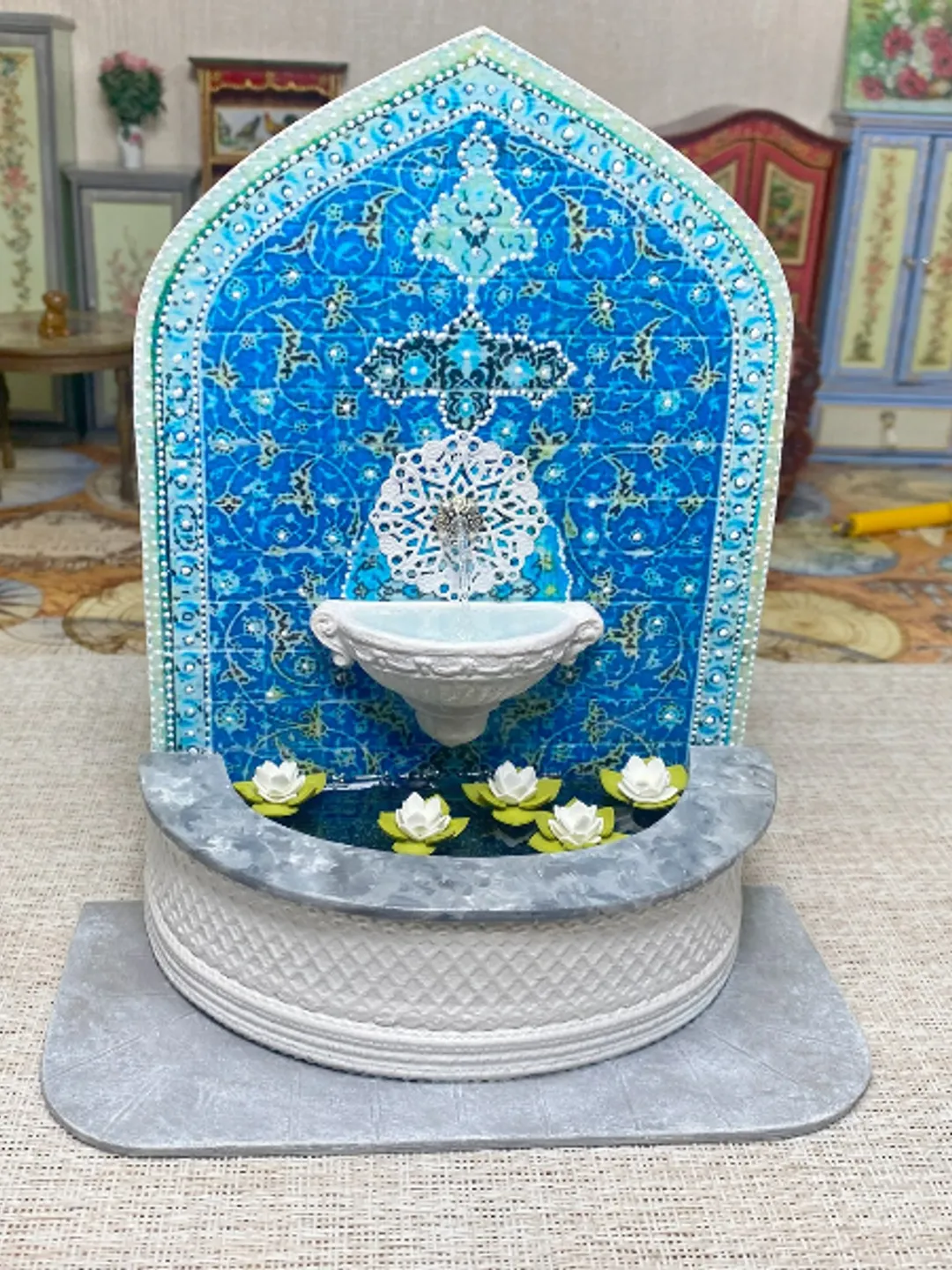 Wall fountain with lotuses. Dollhouse miniature. 1:12.