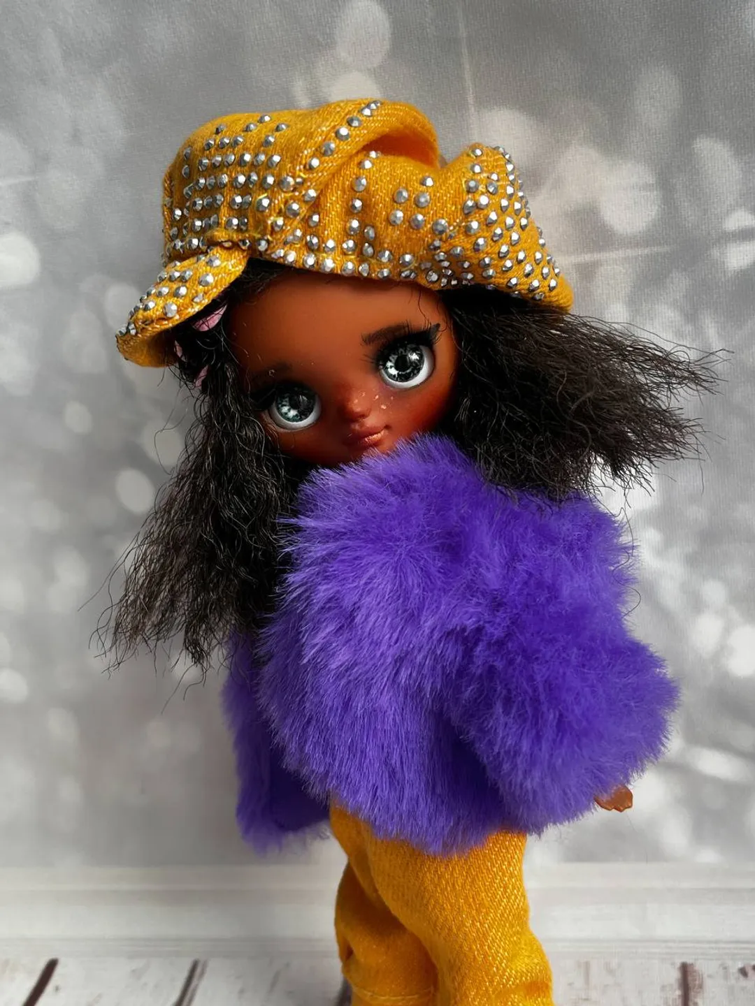 Petite Blythe with dark skin. Adorable miniature doll on an articulated body.