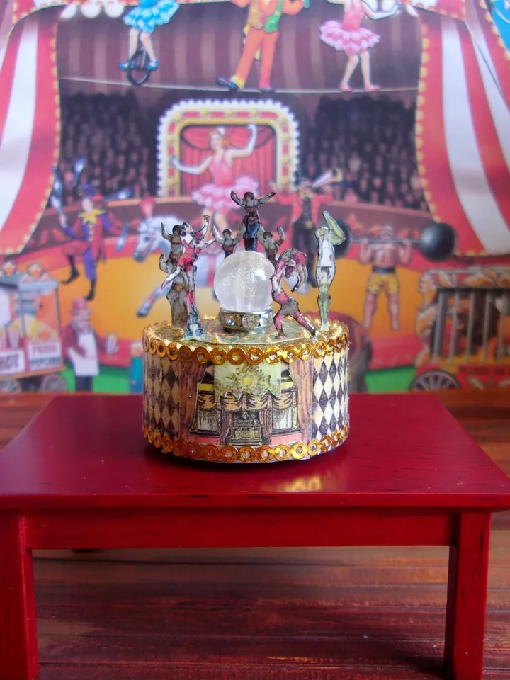 Mini circus with lights. acrobats on stage. LED candle