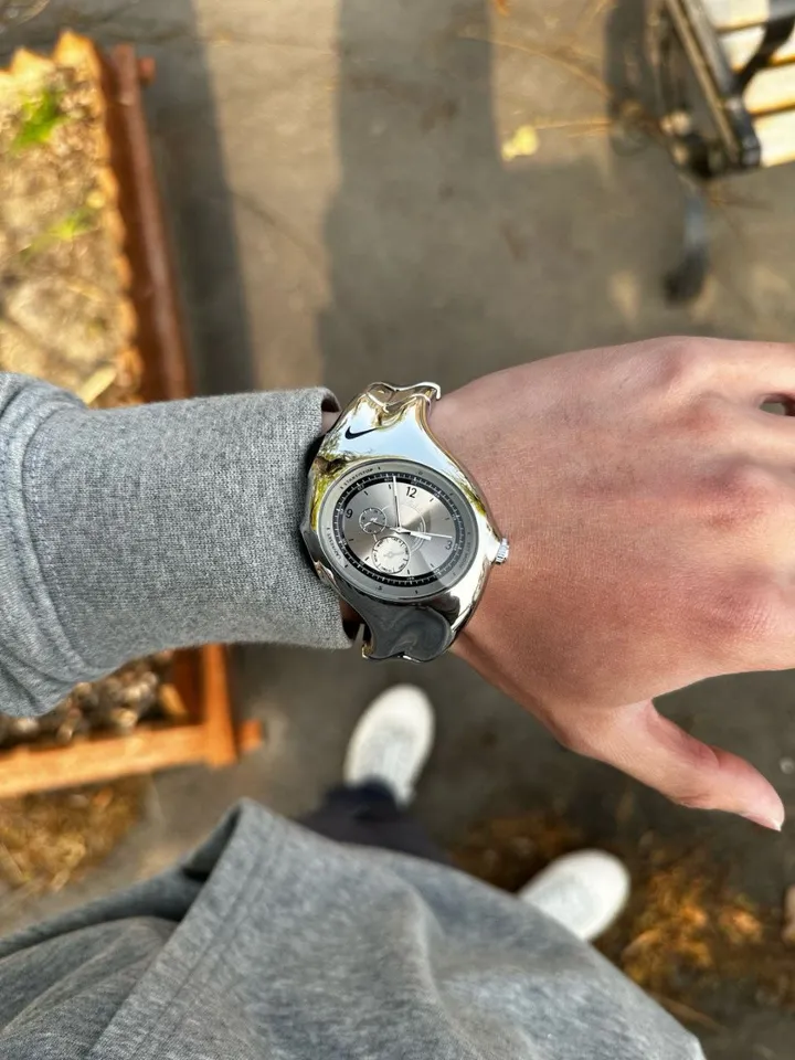 Nike Triax wristwatch: glossy silver case and dial