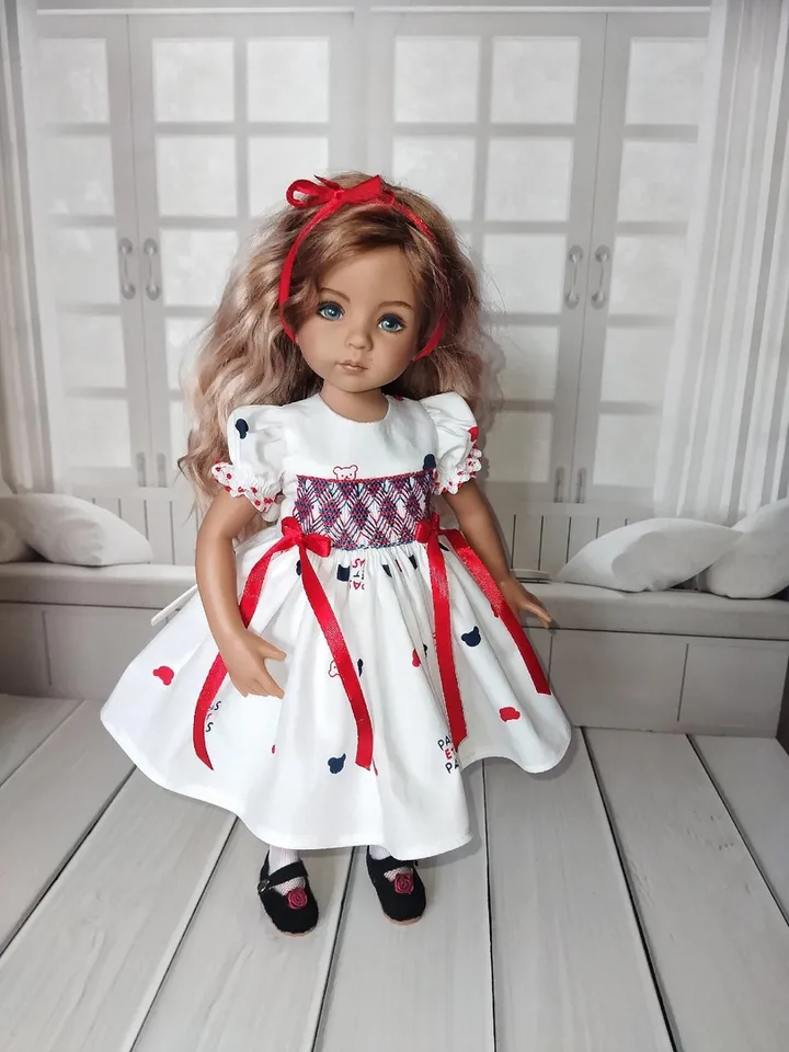 Smocked dress with hand embroidery.